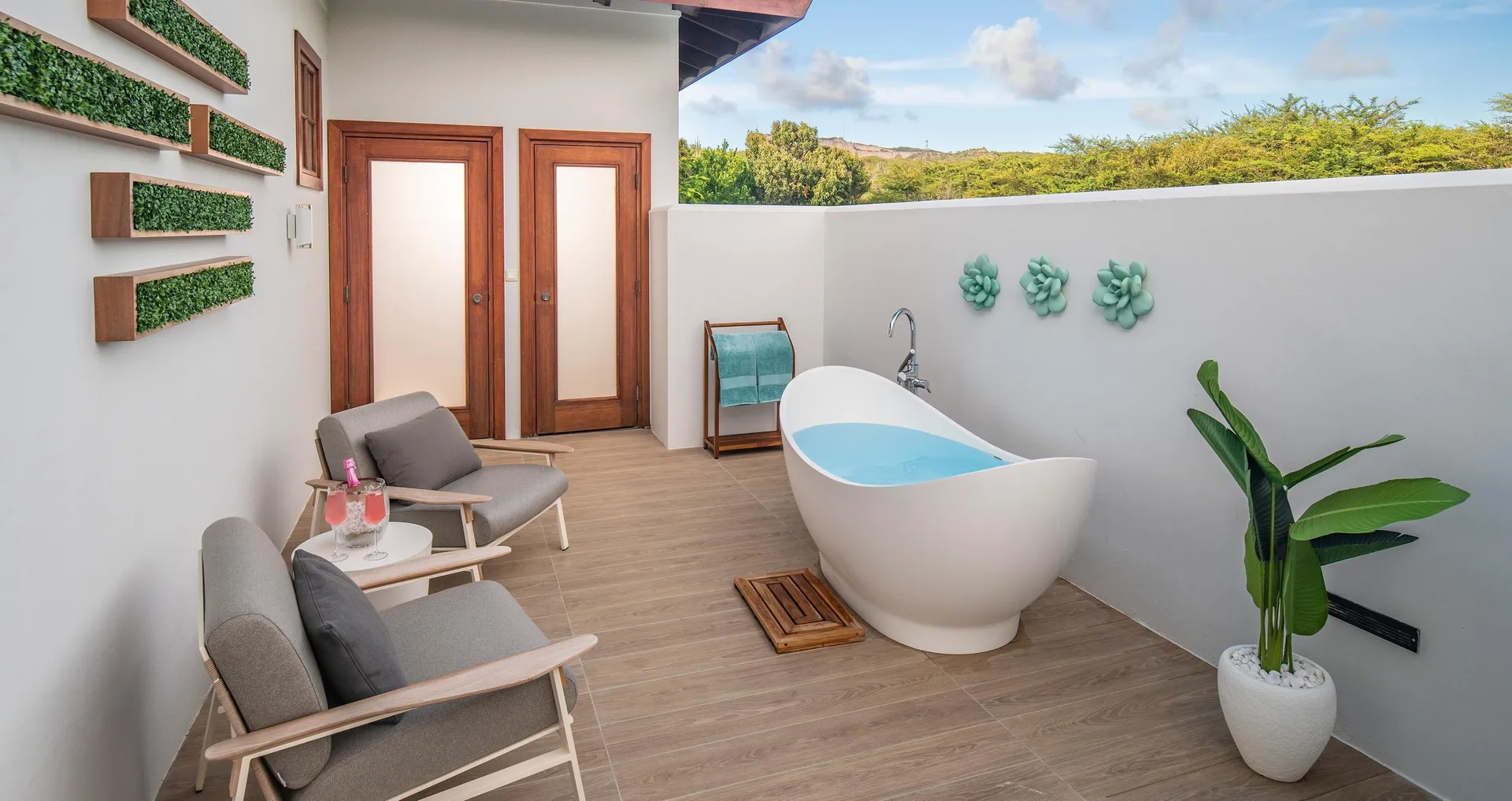 Private terrace with outdoor soaking tub at Sandals Royal Curacao.