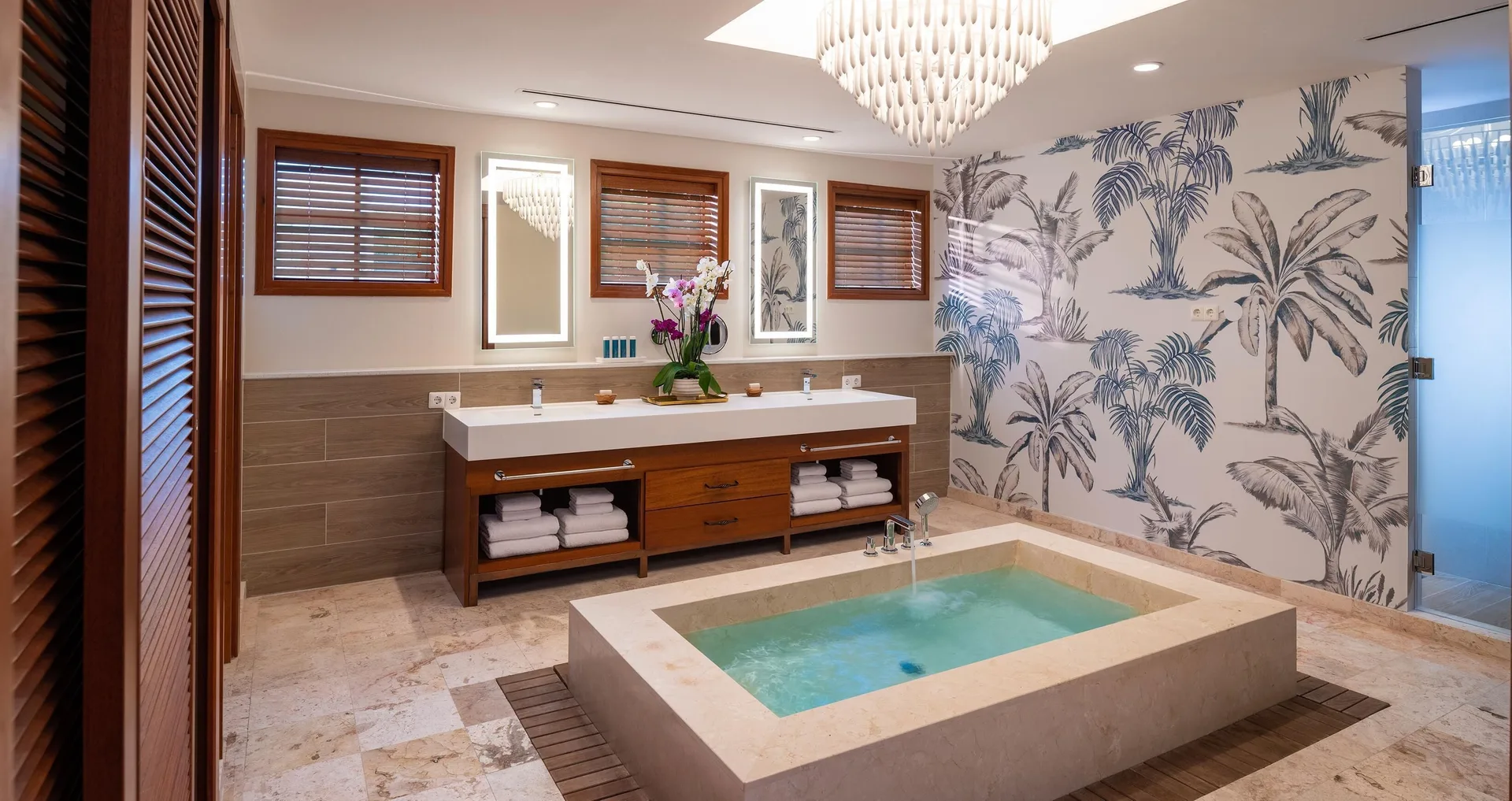 Spacious bathroom with soaking tub and double vanity at Sandals Royal Curacao.