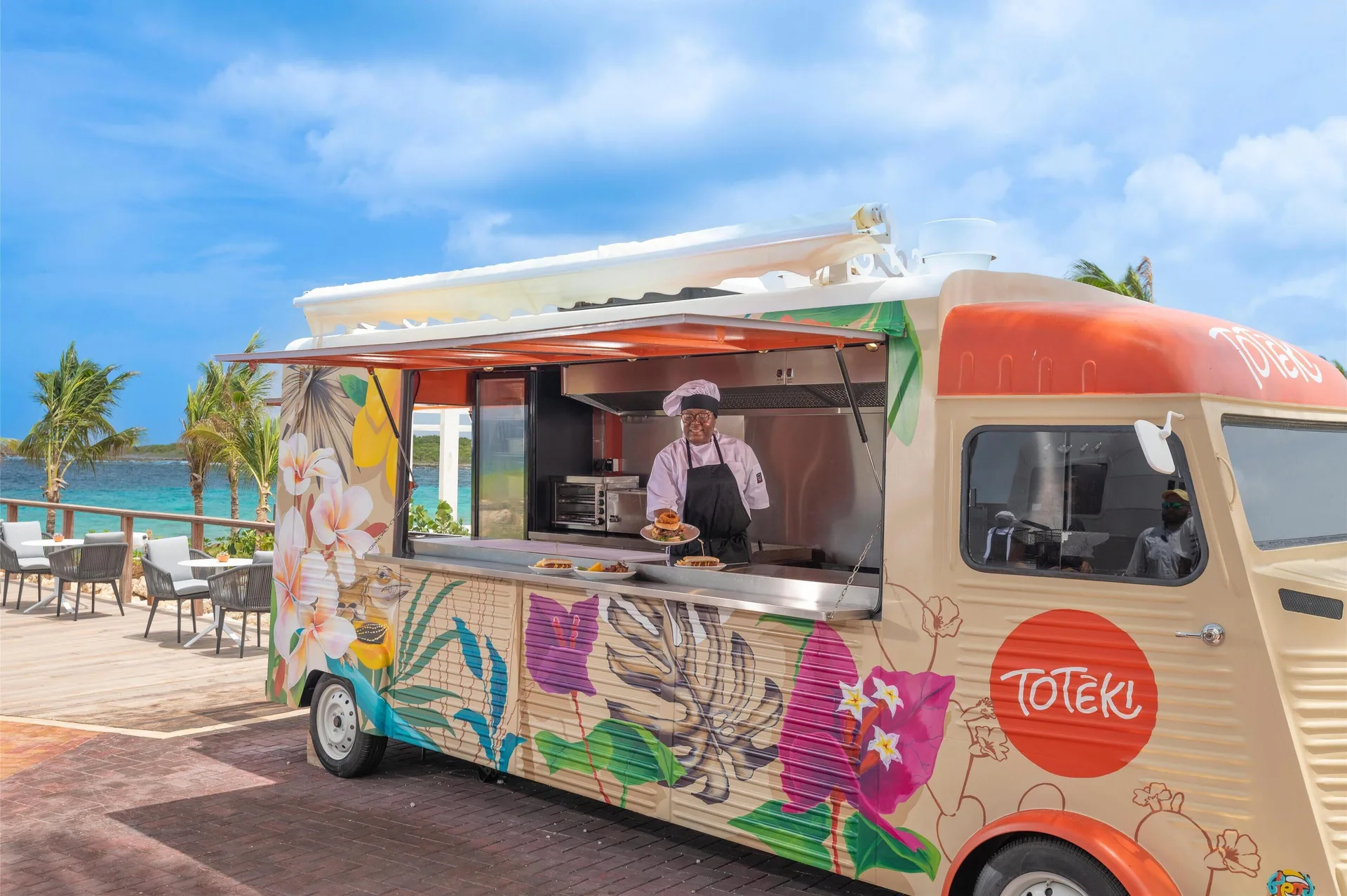 Toteki food truck serving guests by the sea at Sandals Royal Curacao.