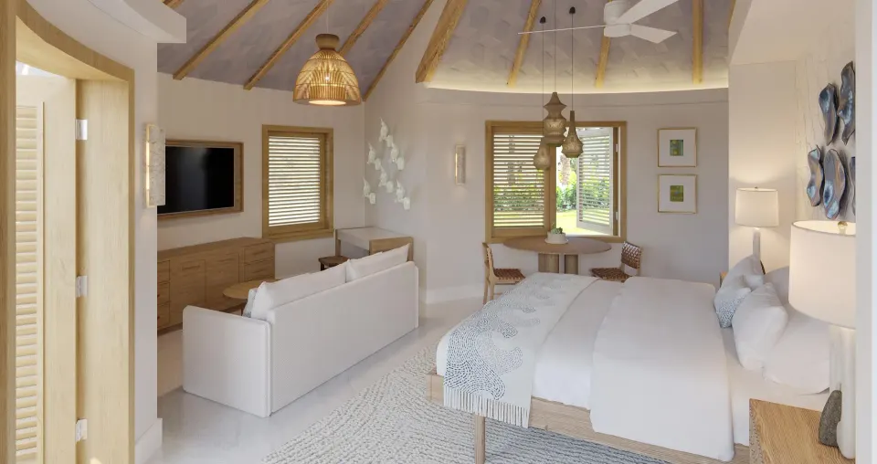 Asombroso Rondoval Butler Villa king bed and sitting area at Sandals Royal Curacao.