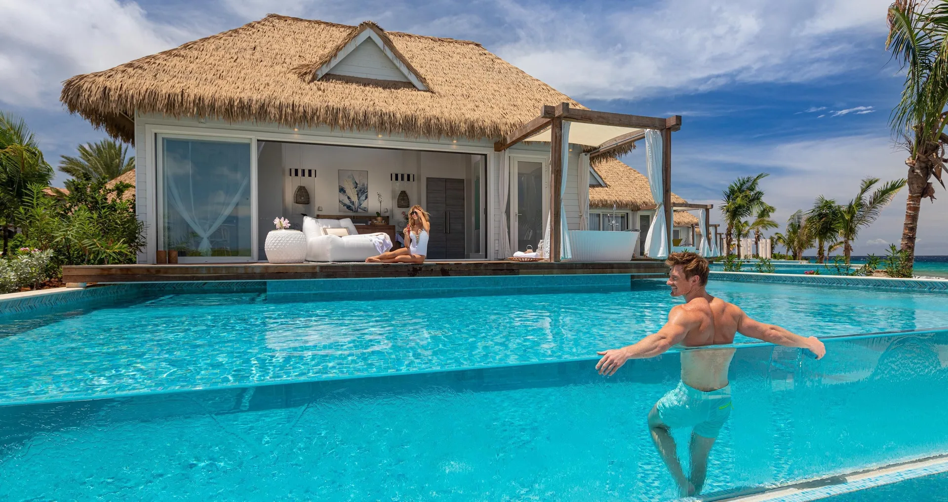 Awa Seaside Butler Bungalow with king bed, terrace tub, and pool at Sandals Royal Curacao.