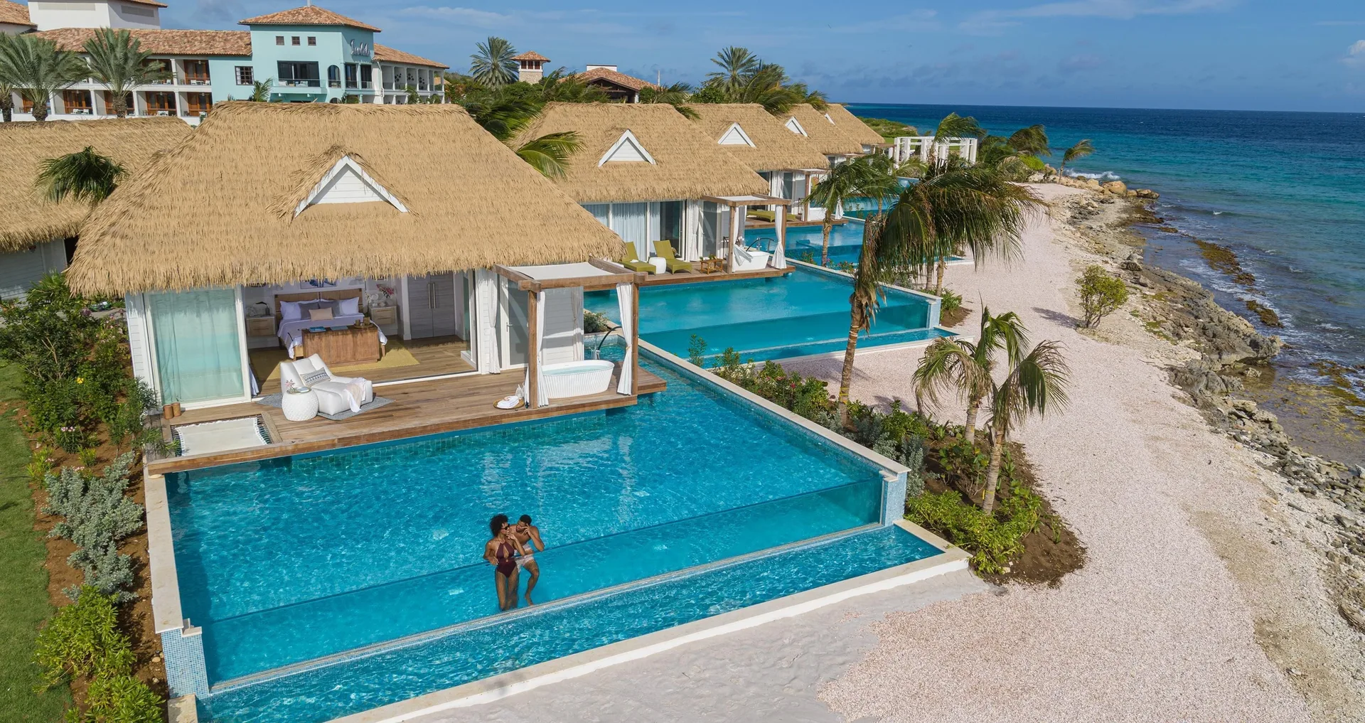 Awa Seaside Butler Bungalows with private pools beside the beach at Sandals Royal Curacao.