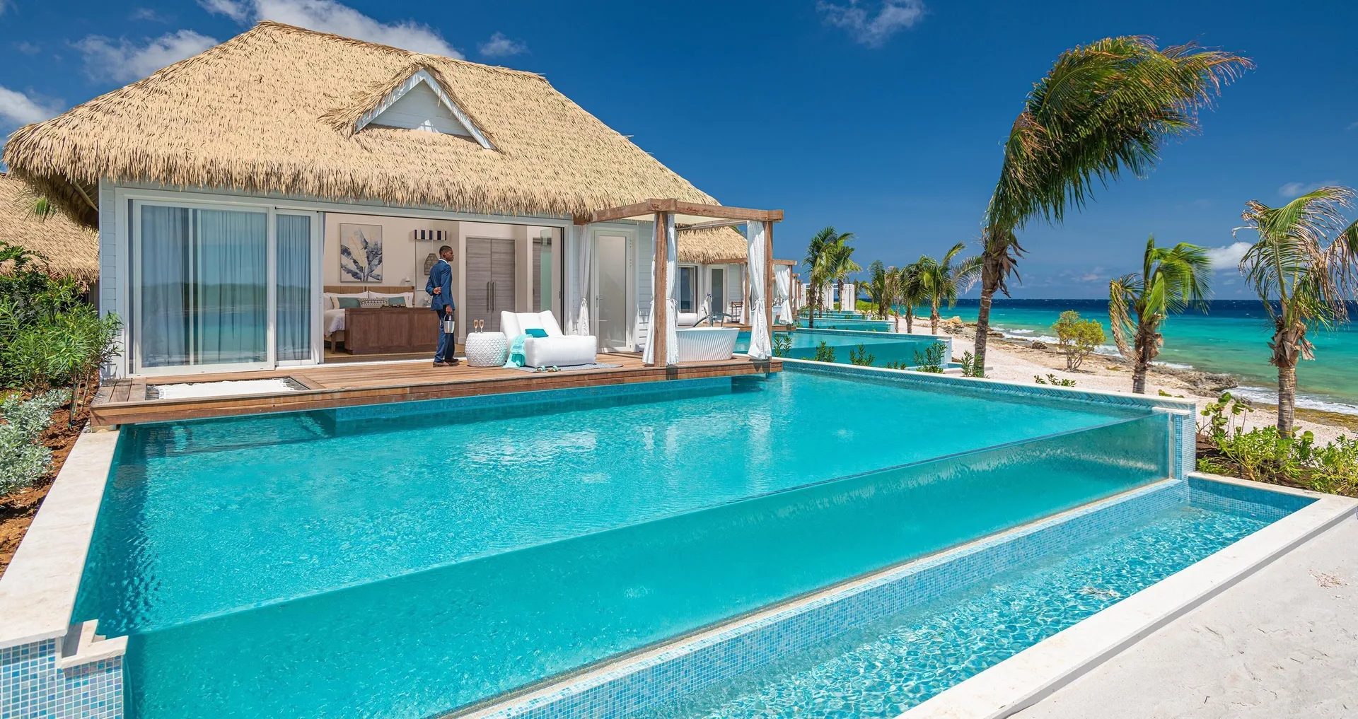 Awa Seaside Butler Bungalow terrace with private pool and ocean beyond at Sandals Royal Curacao.