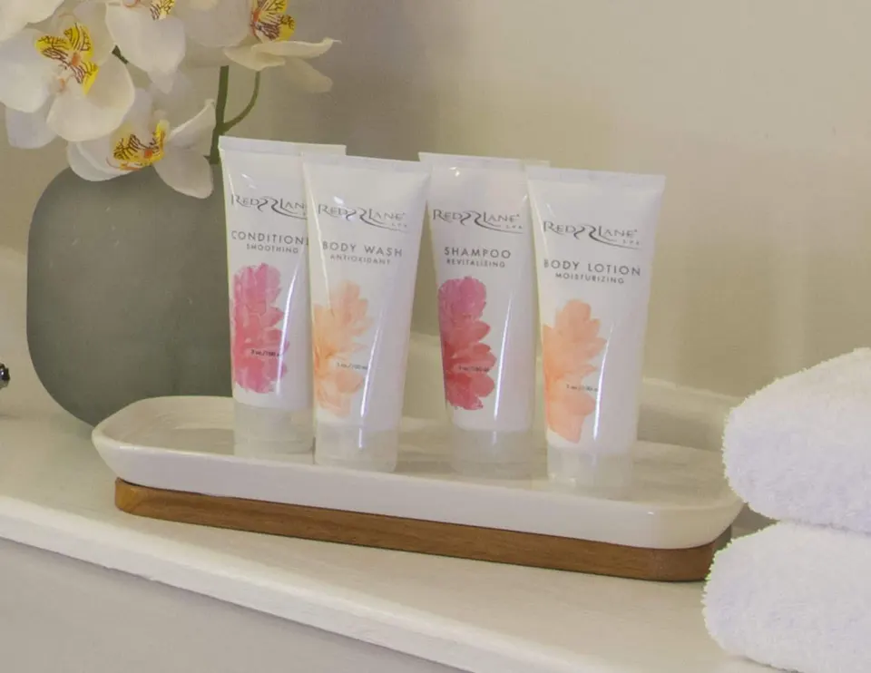 Bathroom amenities and towels in a Carisia room at Sandals Royal Curacao.