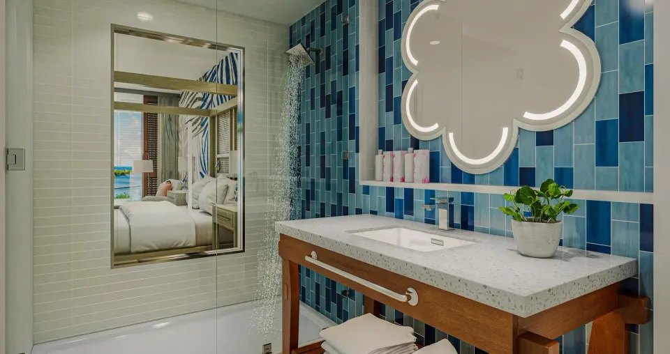 Carisia Club Level Oceanview Room bathroom with blue tile shower at Sandals Royal Curacao.