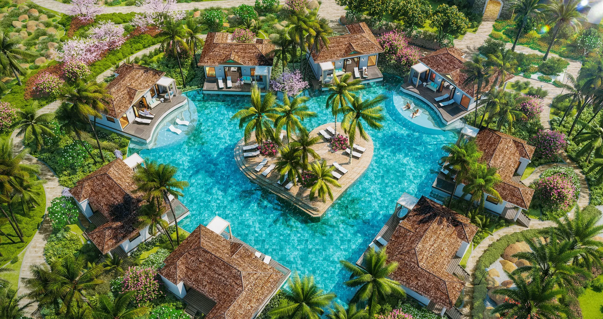 Aerial view of poolside bungalows around an island pool at Sandals Royal Curacao.