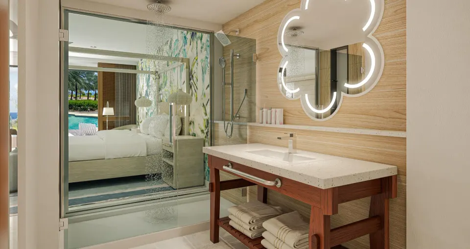 Bathroom vanity and glass shower beside the Subi Junior Suite at Sandals Royal Curacao.