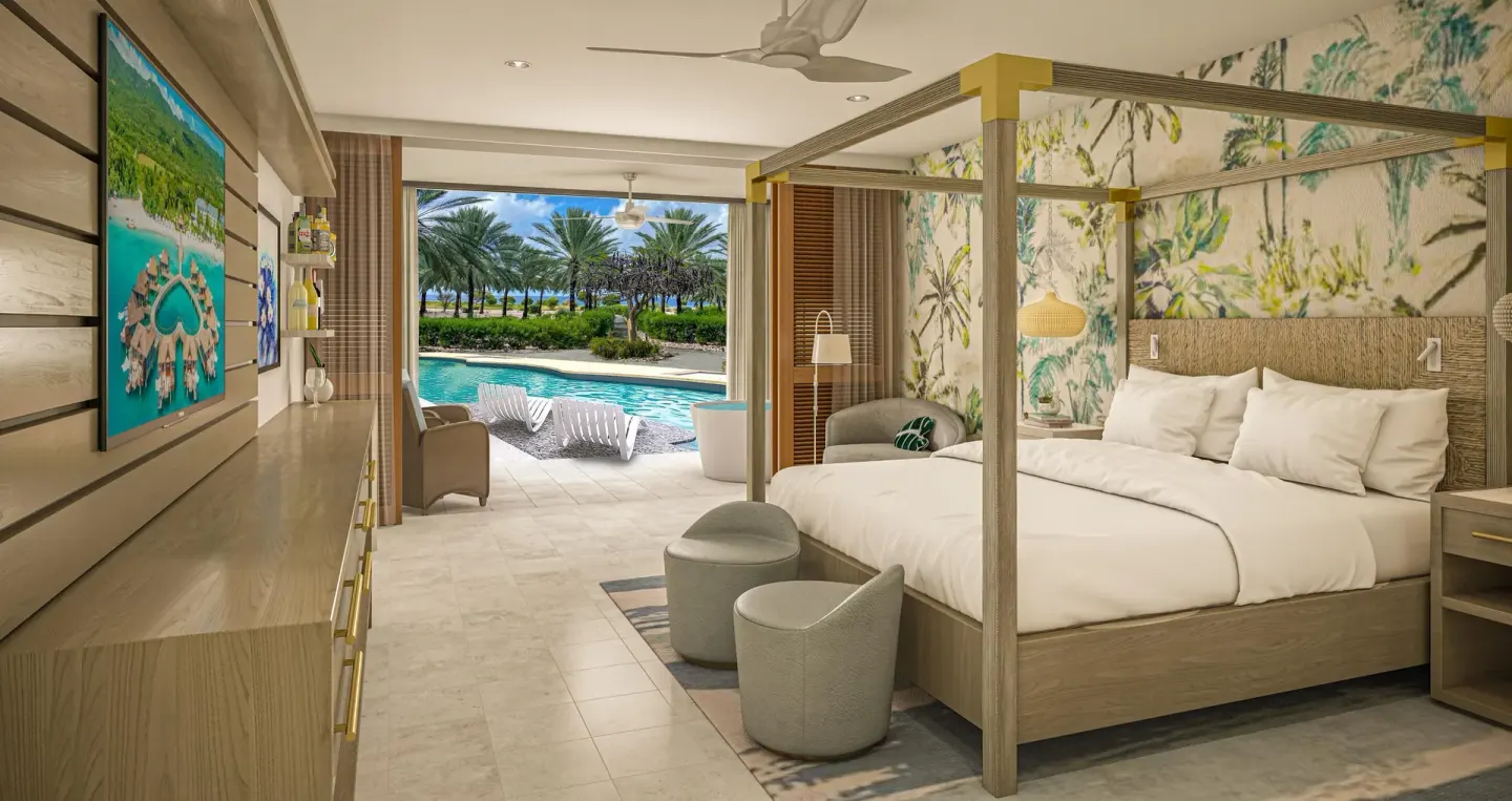 Swim-up junior suite with king bed and patio pool at Sandals Royal Curacao.