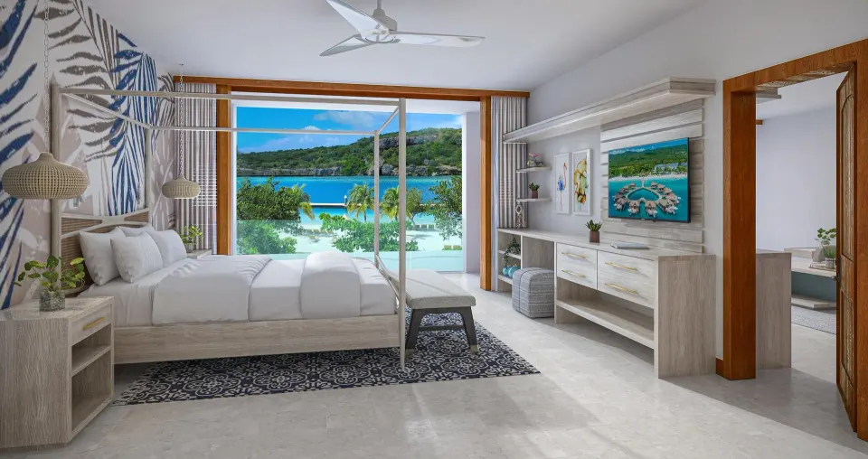 King bed in the Sunchi beachfront suite at Sandals Royal Curacao with wide ocean views.