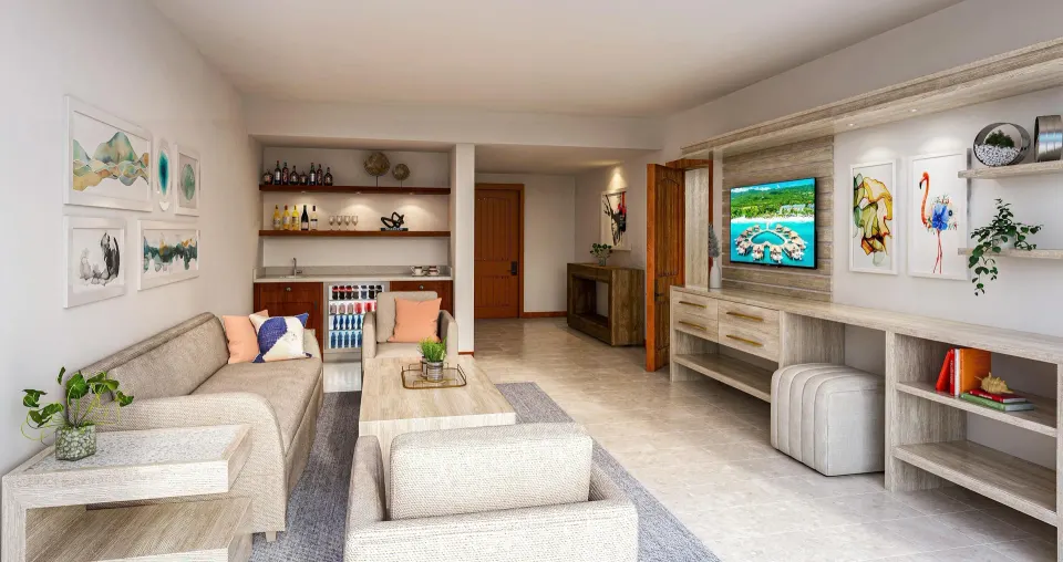 Living room of the Sunchi suite at Sandals Royal Curacao with sofa, bar, and TV wall.