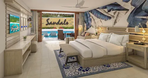 King bed and swim-up patio in a junior suite at Sandals Royal Curacao.