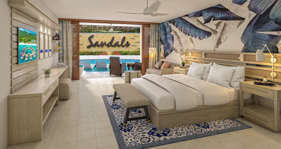 King bed and swim-up patio in a junior suite at Sandals Royal Curacao.