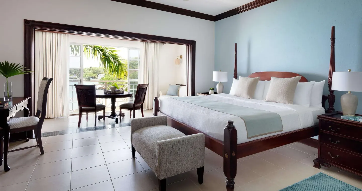 Grand Duke Oceanfront Butler Suite bedroom with king bed at Sandals Royal Plantation.