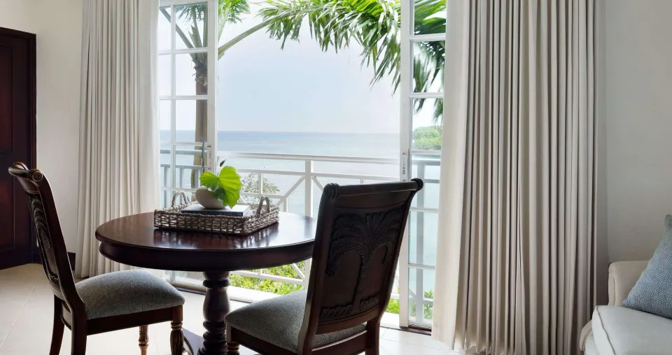 Ocean-view sitting area in the Grand Duke Suite at Sandals Royal Plantation.