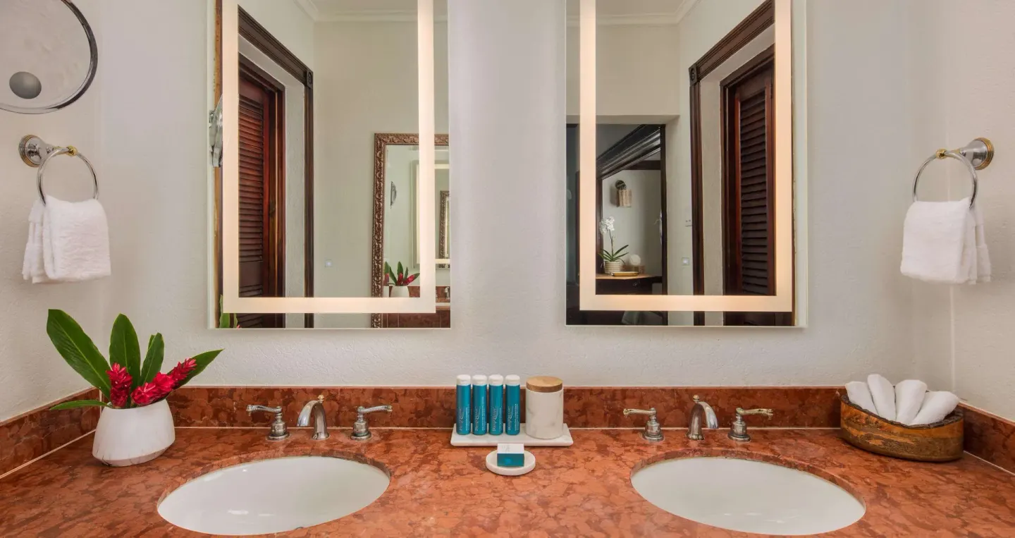 Double vanity bathroom in a Honeymoon Suite at Sandals Royal Plantation.