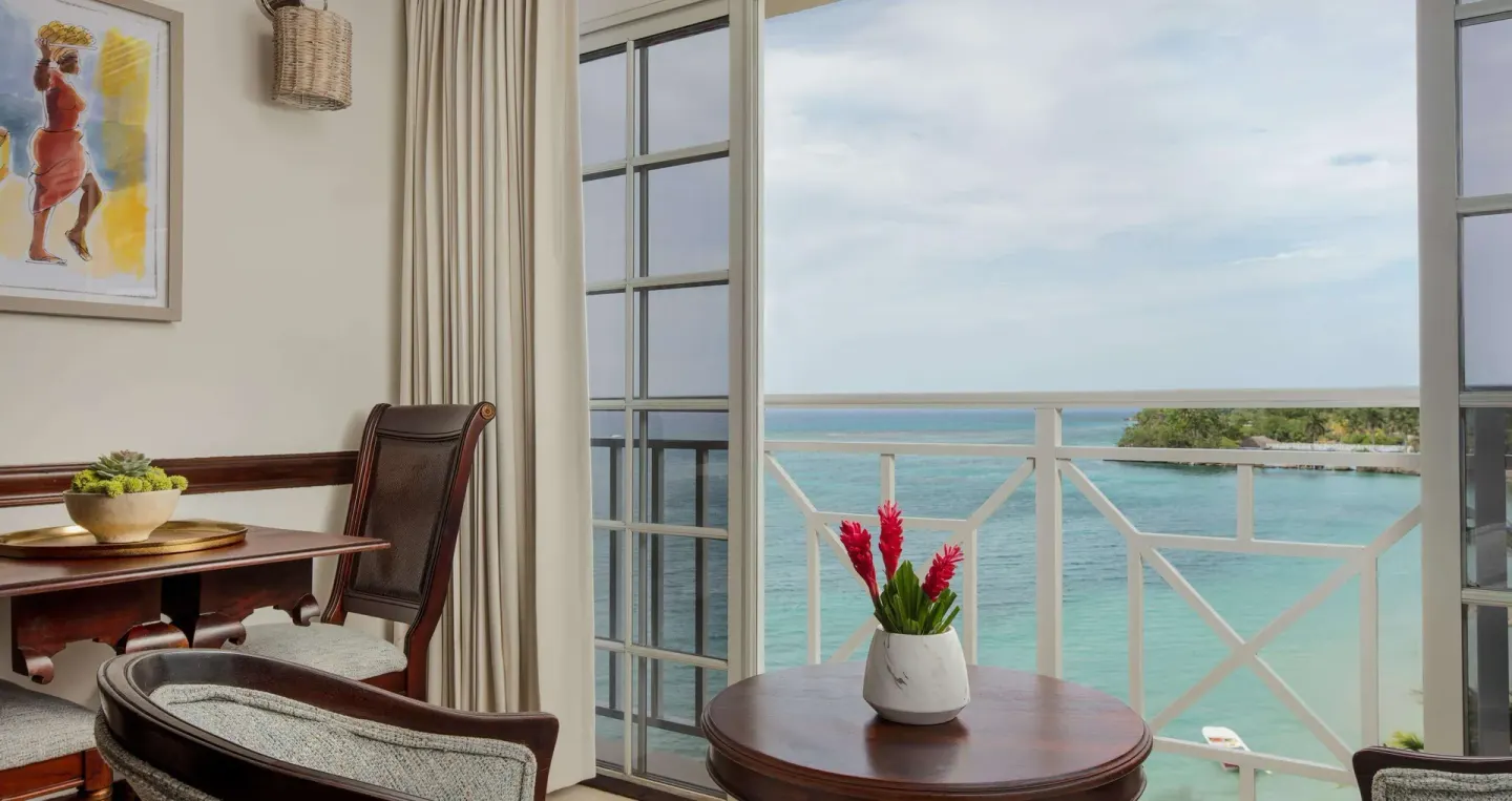 Ocean-view sitting area in a Honeymoon Suite at Sandals Royal Plantation.