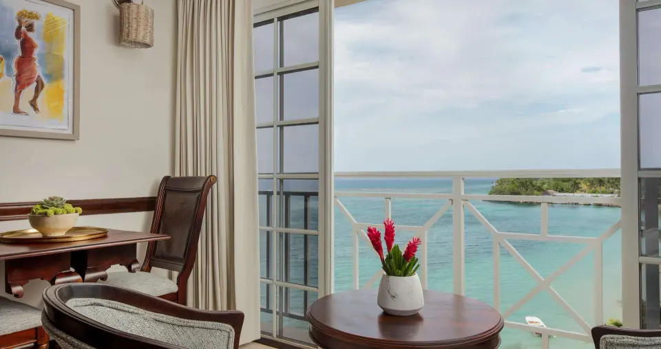 Ocean-view sitting area in a Honeymoon Suite at Sandals Royal Plantation.