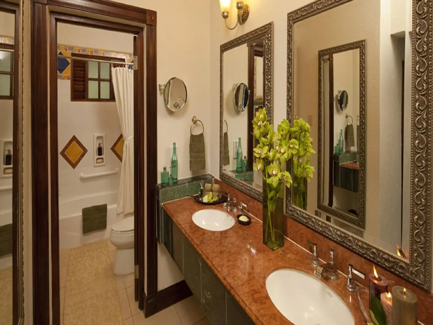 Double vanity and shower area in a Monarch Oceanfront Butler Suite bathroom at Sandals Royal Plantation.