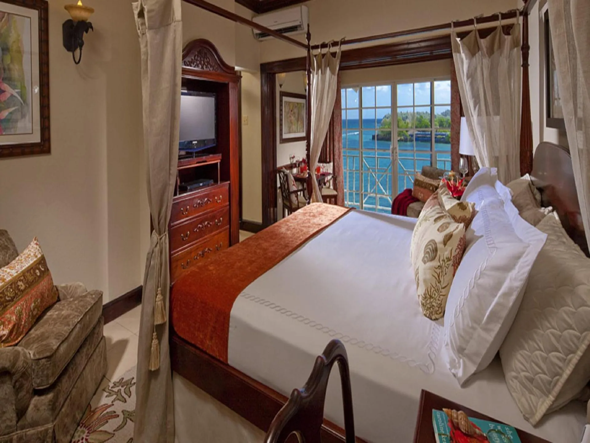 Villa Plantana at Sandals Royal Plantation with luxurious king bed, elegant décor, and panoramic ocean views in Ocho Rios, Jamaica.