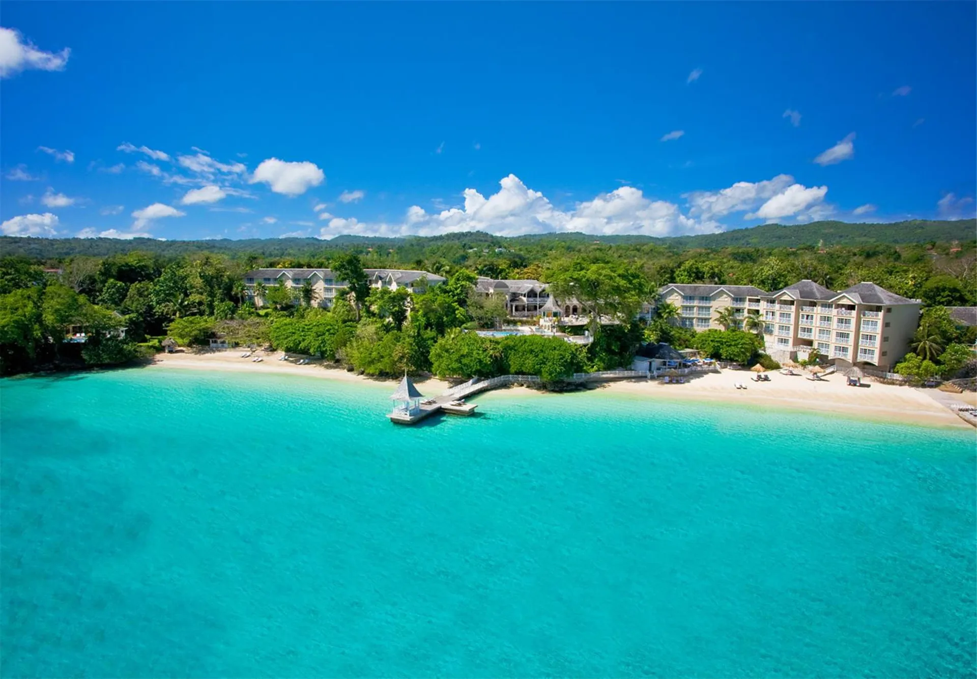 Aerial view of Sandals Royal Plantation beachfront and turquoise water from the Monarch Oceanfront Butler Suite.