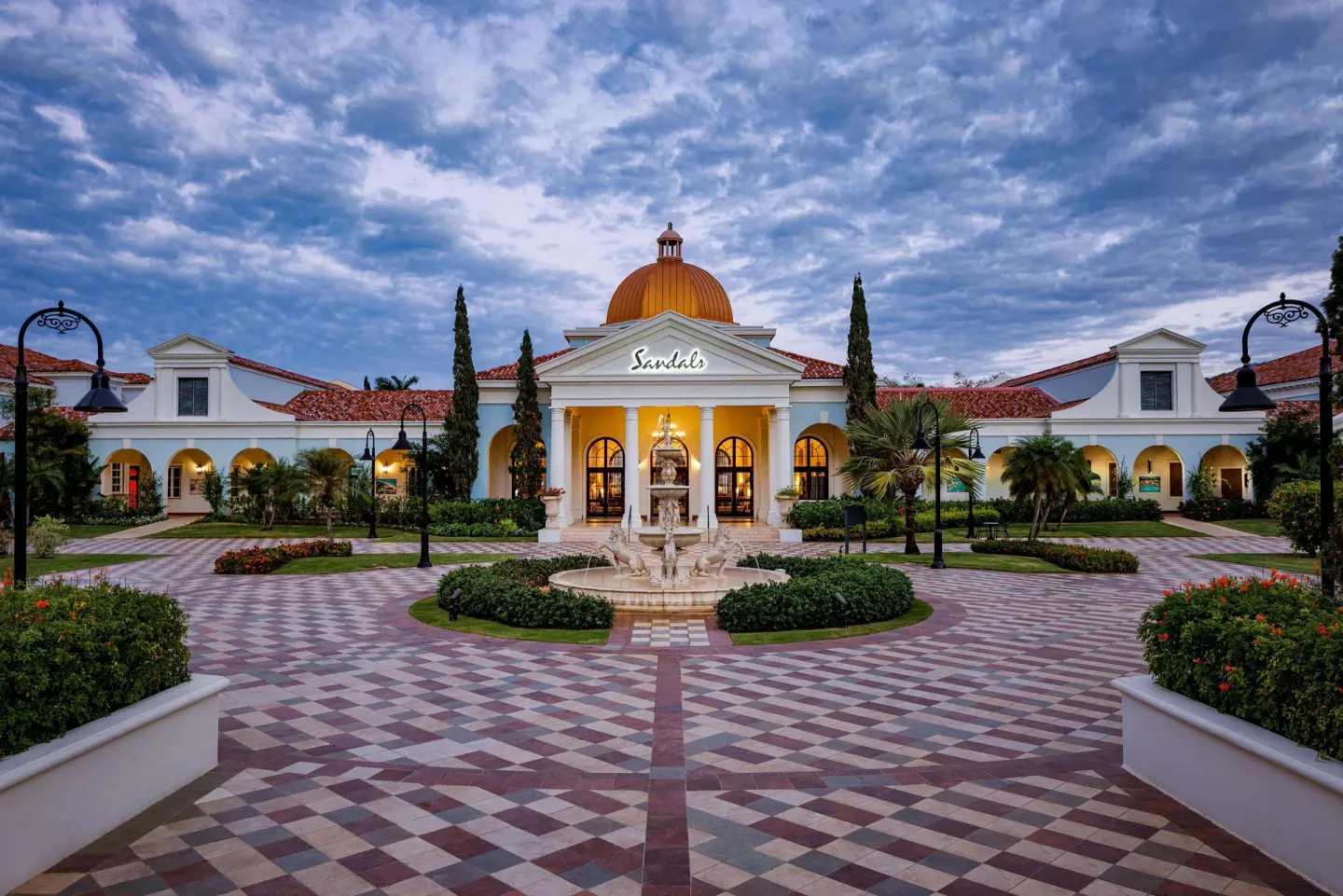 Courtyard entrance with fountain and domed building at Sandals South Coast.