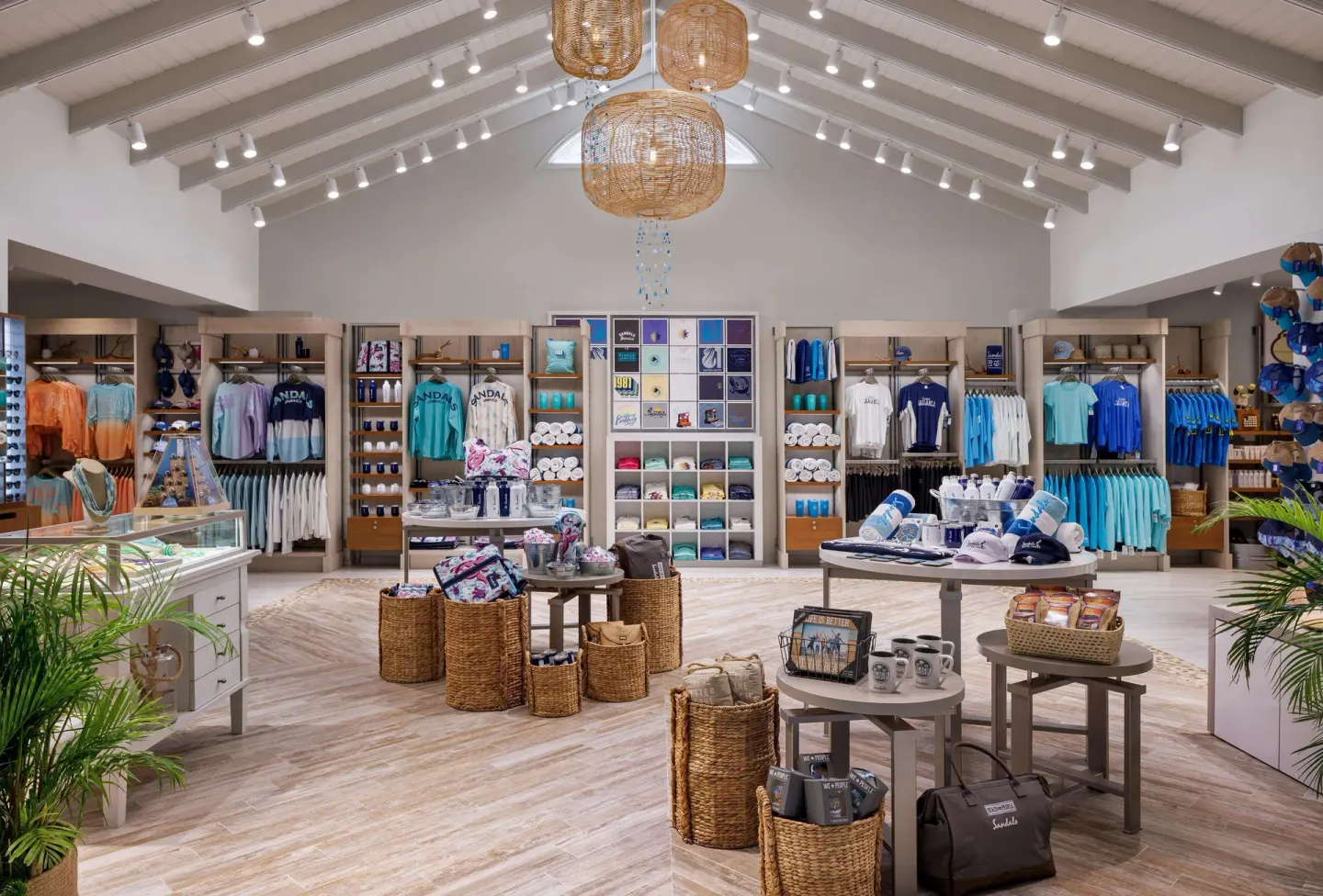 Resort shop with clothing, hats, bags, and souvenirs on display at Sandals South Coast.