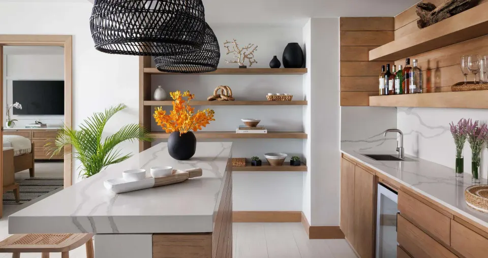 Beachfront club room kitchenette with bedroom beyond at Sandals South Coast.