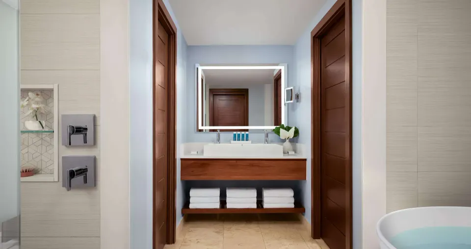Suite bathroom vanity and soaking tub detail at Sandals South Coast.