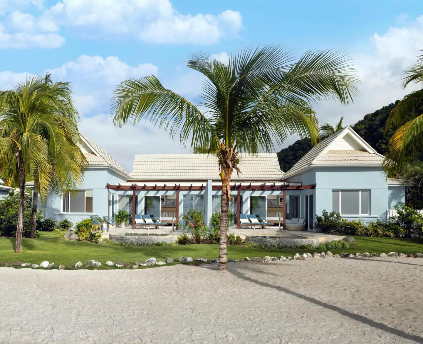 Beachfront villa with palm trees and private terraces at Sandals St. Vincent and the Grenadines.