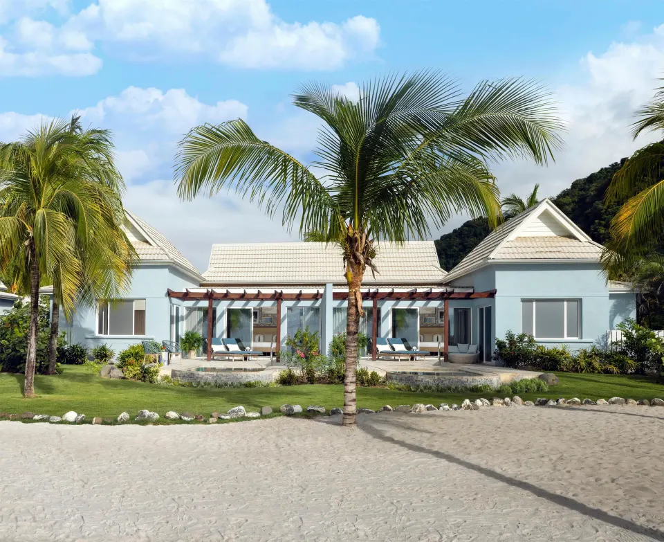 Beachfront villa with palm trees and private terraces at Sandals St. Vincent and the Grenadines.