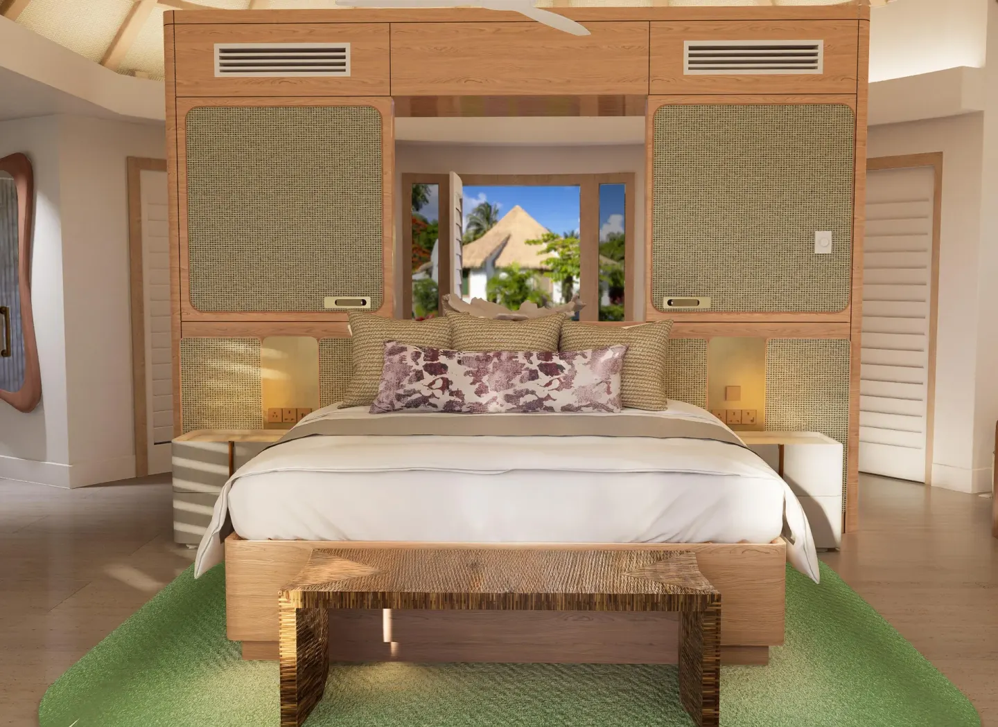 King bed framed by cane panels and a tropical window view at Sandals St. Vincent and the Grenadines.