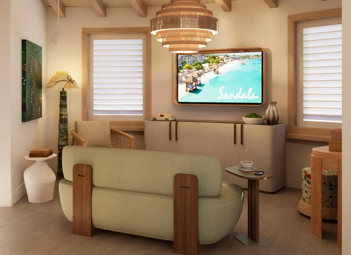 Guest room sitting area with sofa and TV at Sandals St. Vincent and the Grenadines.