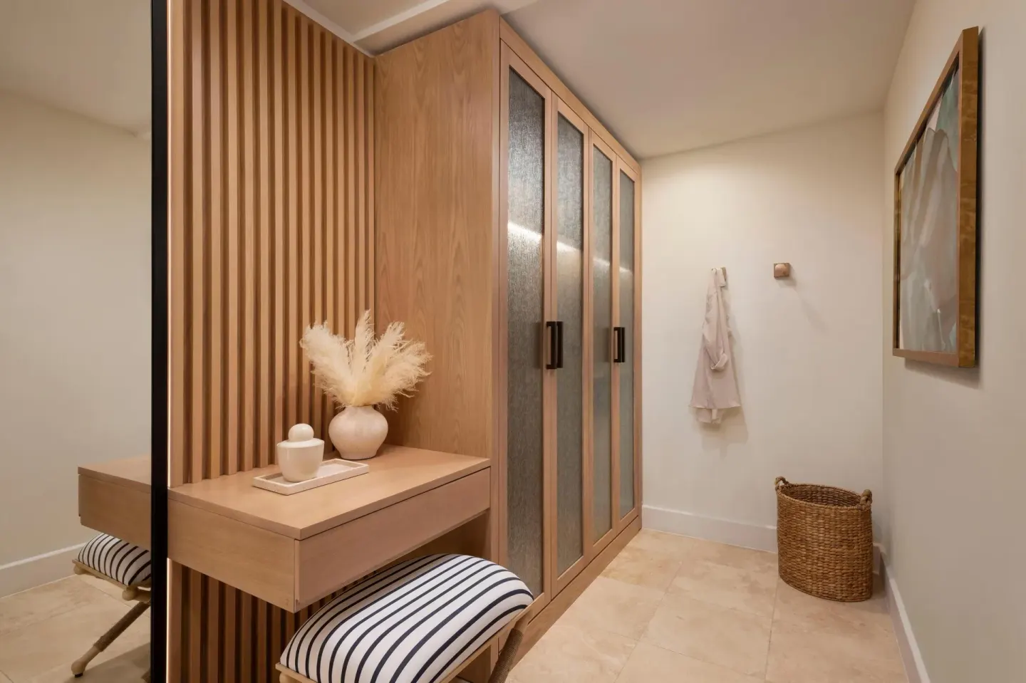 Guest suite dressing area with wardrobe and vanity at Sandals St. Vincent and the Grenadines.