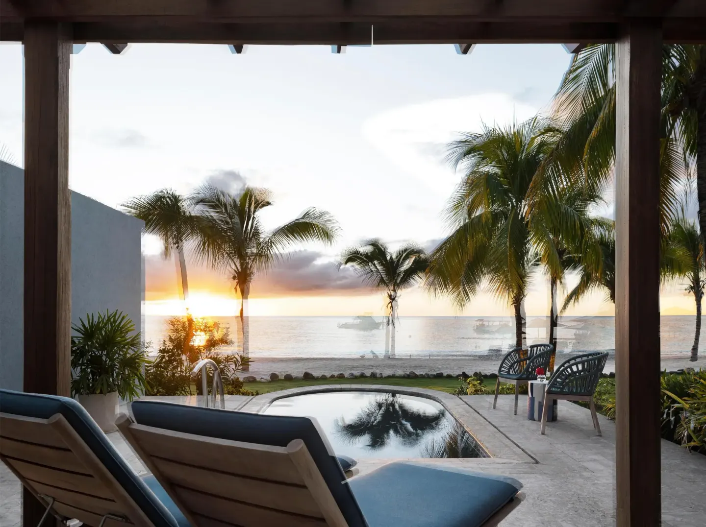 Private patio with plunge pool and ocean sunset at Sandals St. Vincent and the Grenadines.