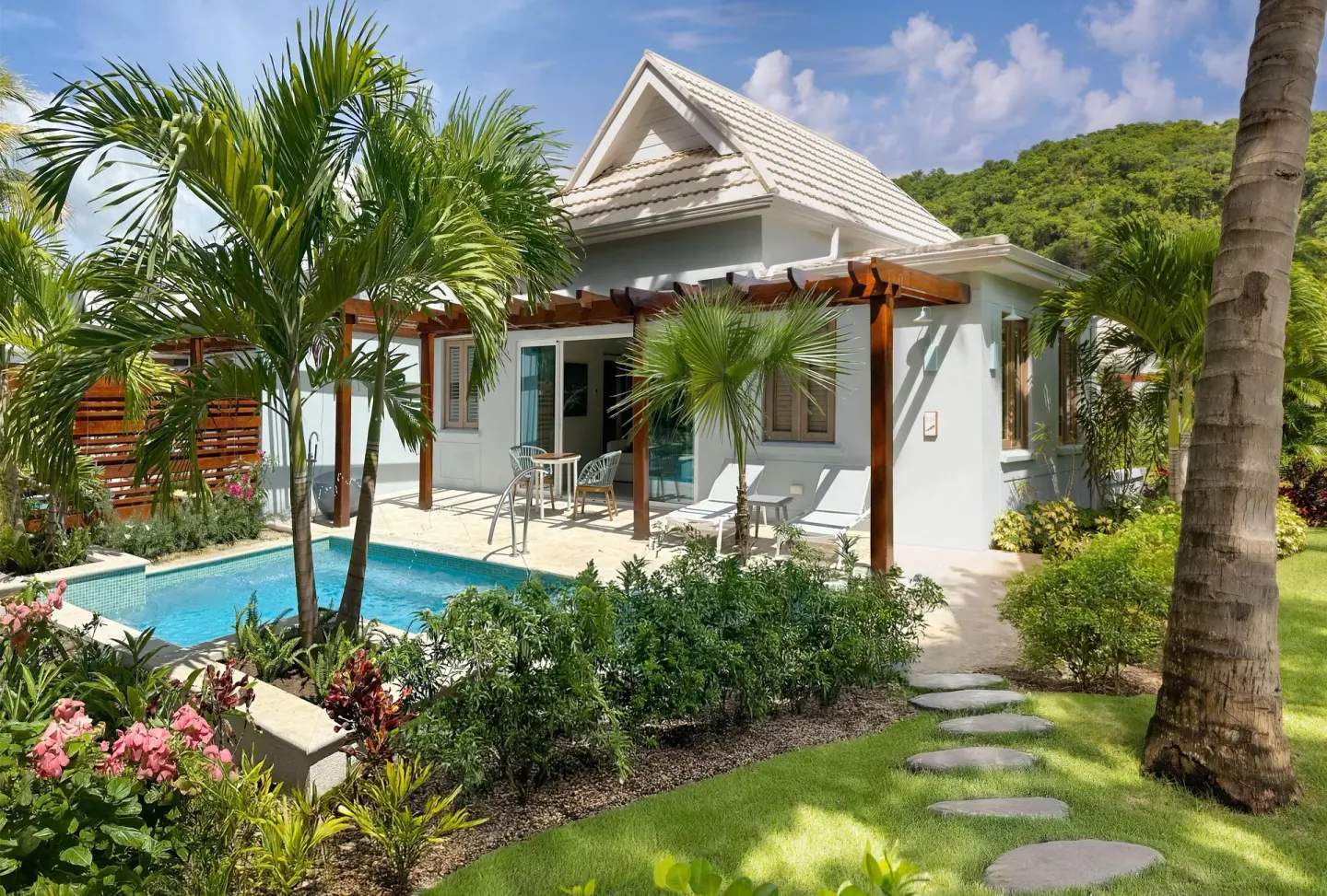 Villa exterior with private pool, patio, and tropical landscaping at Sandals St. Vincent and the Grenadines.