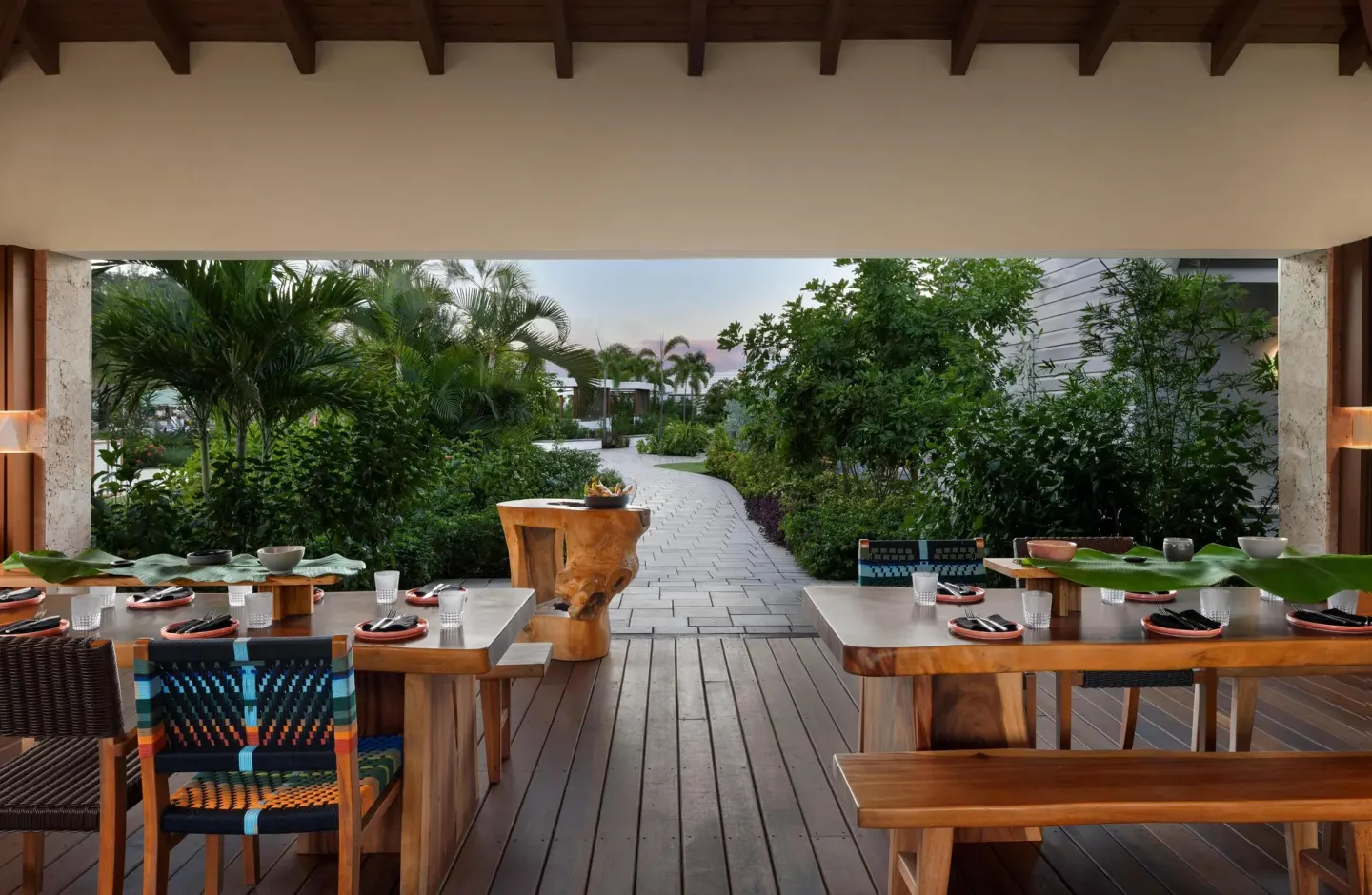 Open-air dining terrace with garden path at Sandals St. Vincent and the Grenadines.