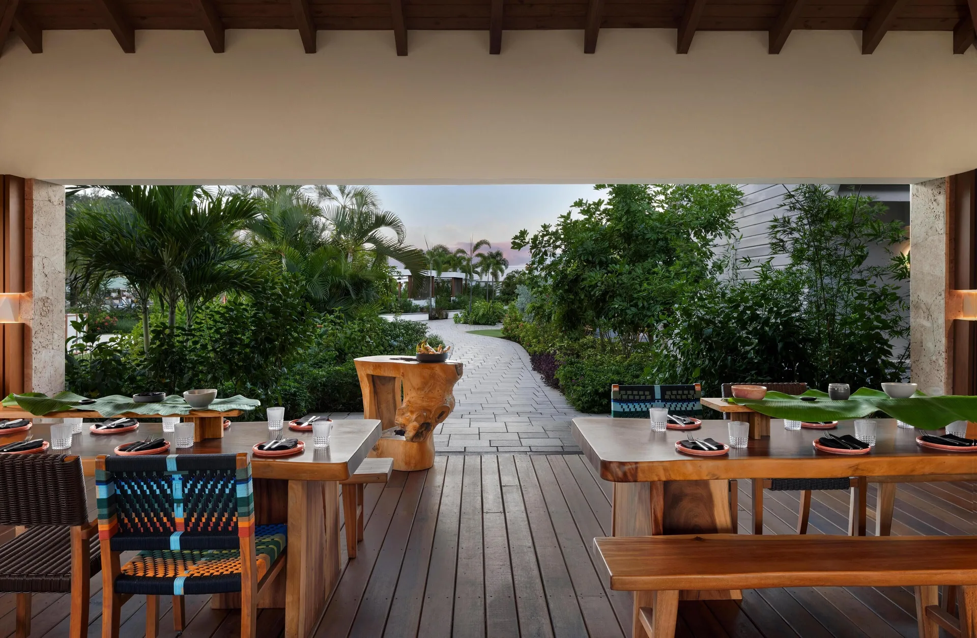 Open-air dining terrace with garden path at Sandals St. Vincent and the Grenadines.