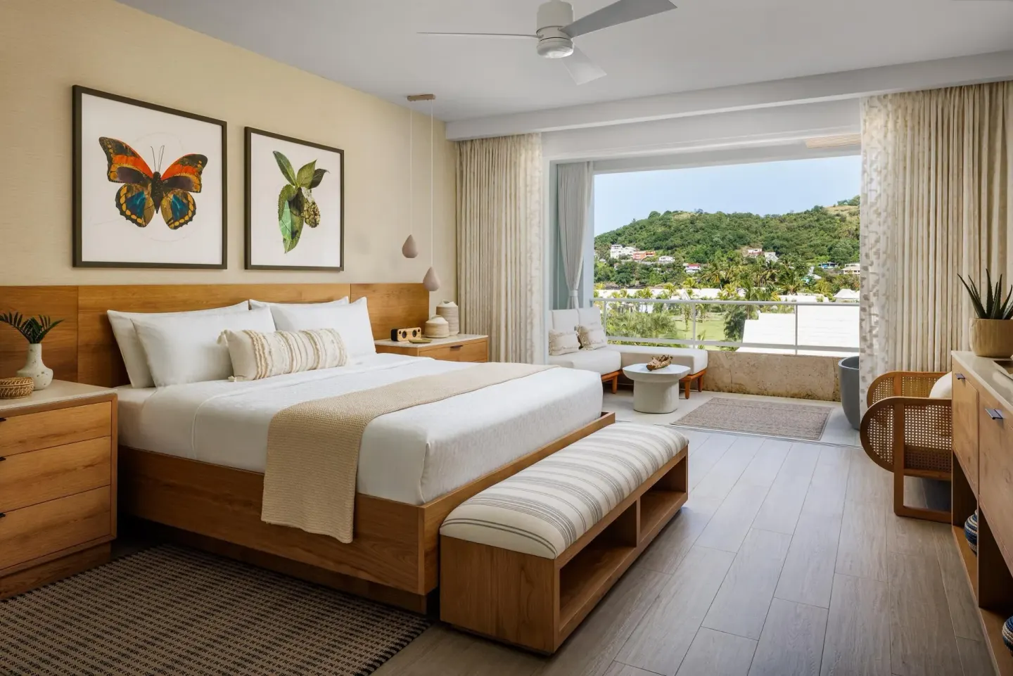 Bamboo Palm guest room with king bed and balcony view at Sandals St. Vincent and the Grenadines.
