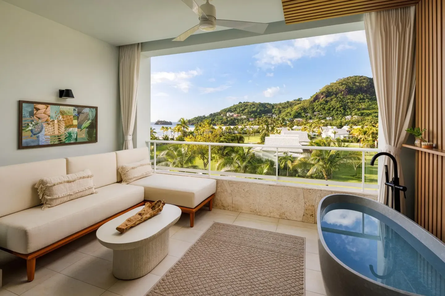 Balcony lounge with soaking tub and tropical view at Sandals St. Vincent and the Grenadines.
