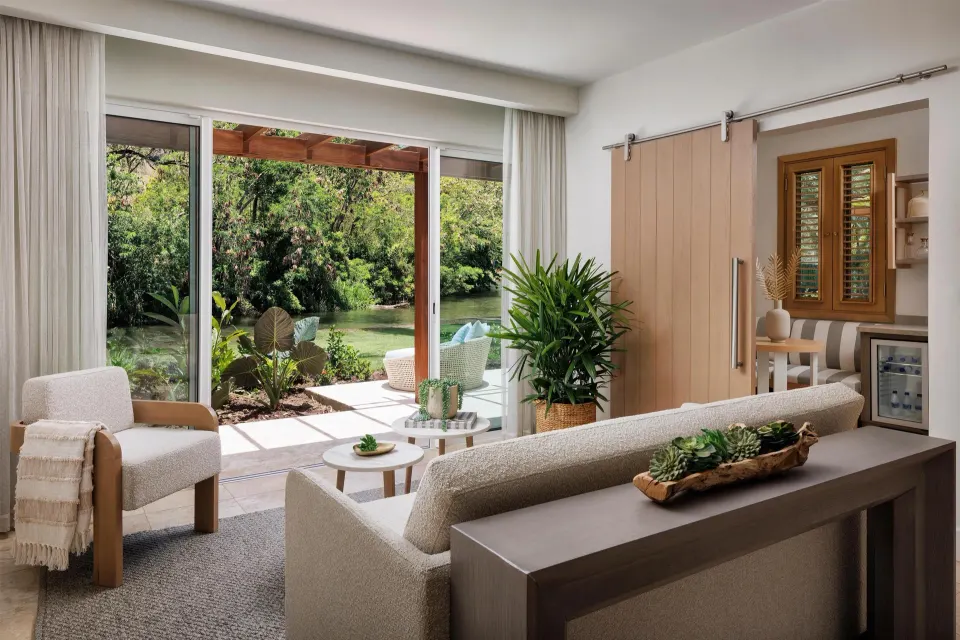 Garden Butler Suite living area and patio doors at Sandals St. Vincent and the Grenadines.