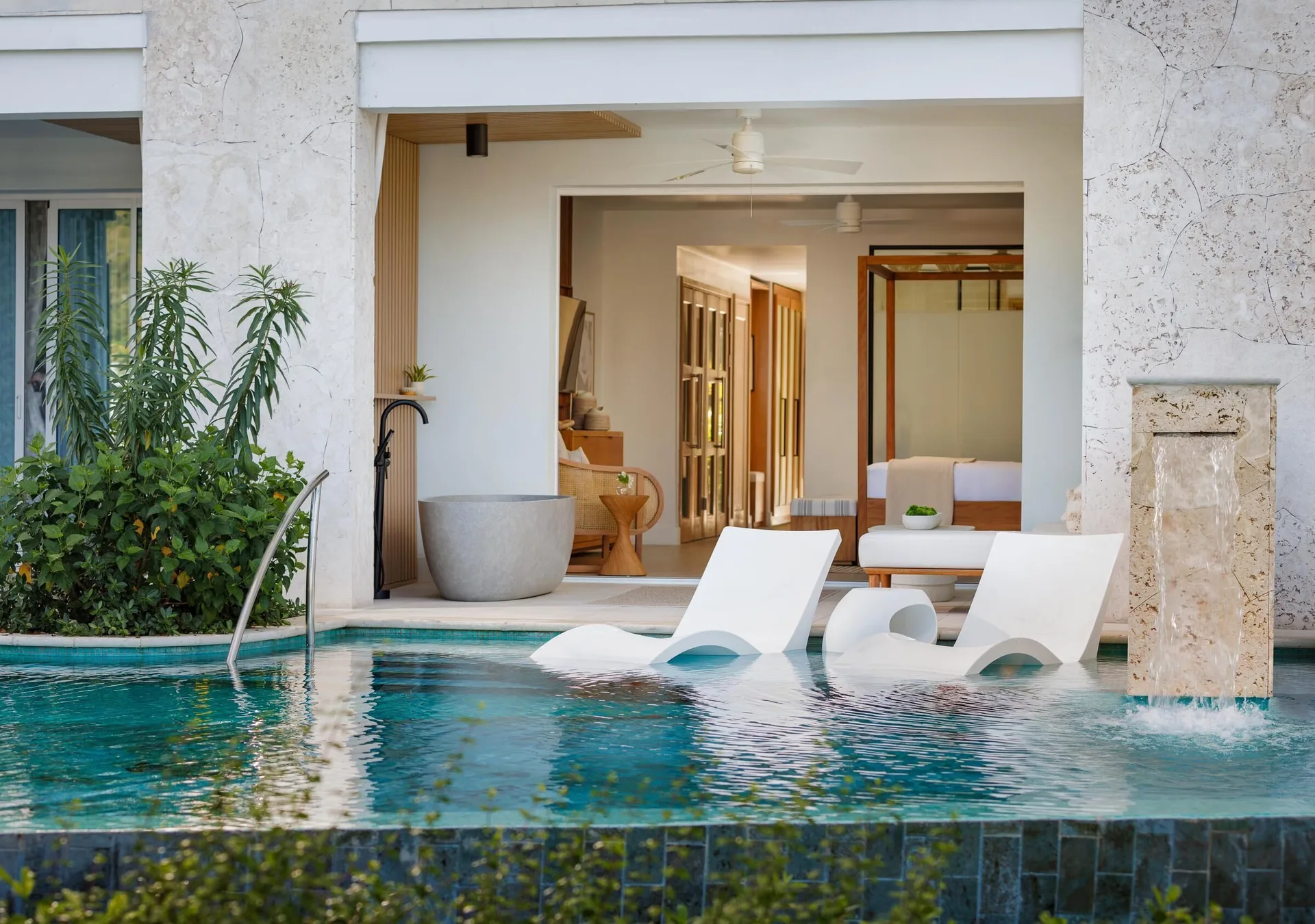 Lady Palm Club Swim-up Suite exterior patio with pool access and loungers at Sandals St. Vincent and the Grenadines.