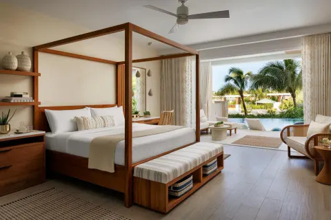 King bed suite with poolside patio at Sandals St. Vincent and the Grenadines.