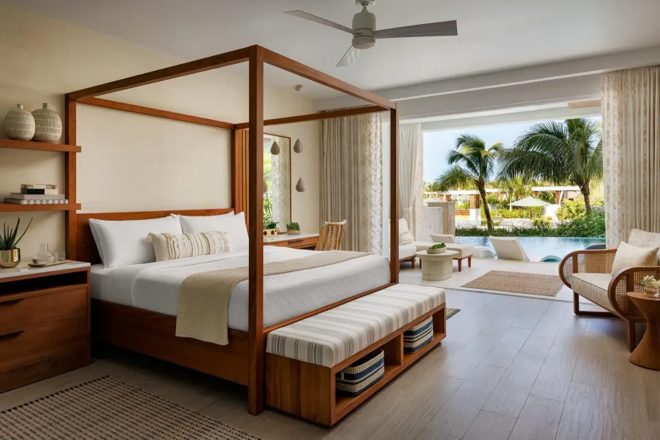 King bed suite with poolside patio at Sandals St. Vincent and the Grenadines.
