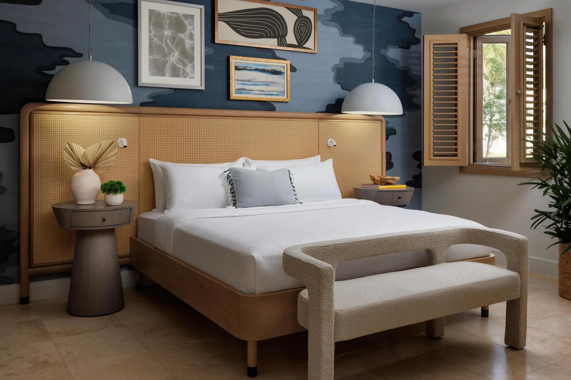 King bed in a garden butler suite bedroom at Sandals St. Vincent and the Grenadines.