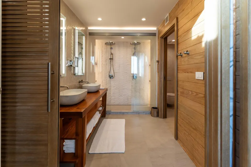 Vincy Overwater Two-Story Villa bathroom with double vanity at Sandals St. Vincent and the Grenadines.
