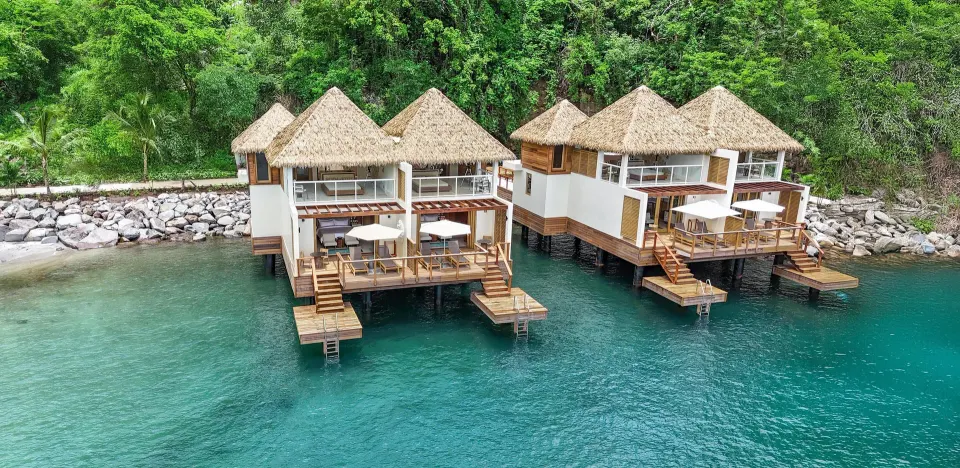 Aerial view of overwater two-story villas at Sandals St. Vincent and the Grenadines.