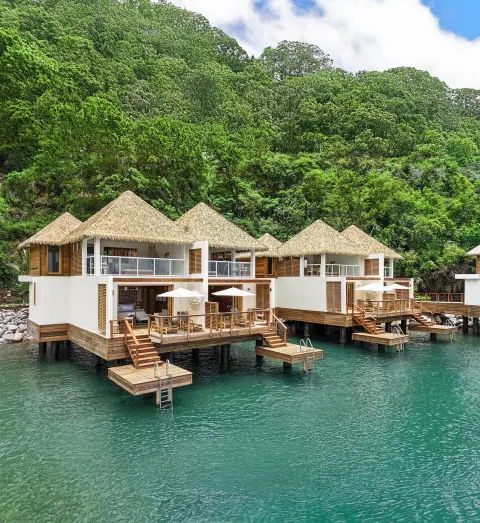 Overwater two-story villas with decks and swim platforms at Sandals St. Vincent and the Grenadines.