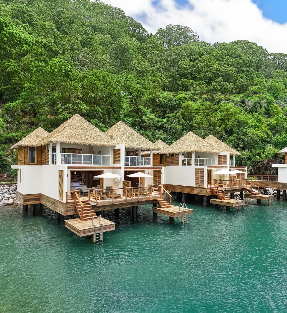 Overwater two-story villas with decks and swim platforms at Sandals St. Vincent and the Grenadines.