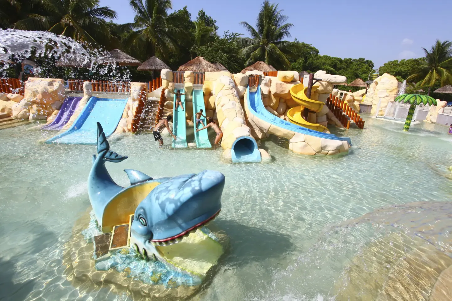 Children’s splash pool with slides and whale figure at Sandos Caracol Nature Resort & Water Park.
