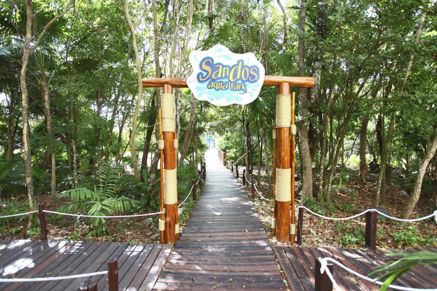 Wooden walkway entrance to Sandos Caracol Nature Resort & Water Park at Sandos Caracol Nature Resort & Water Park.